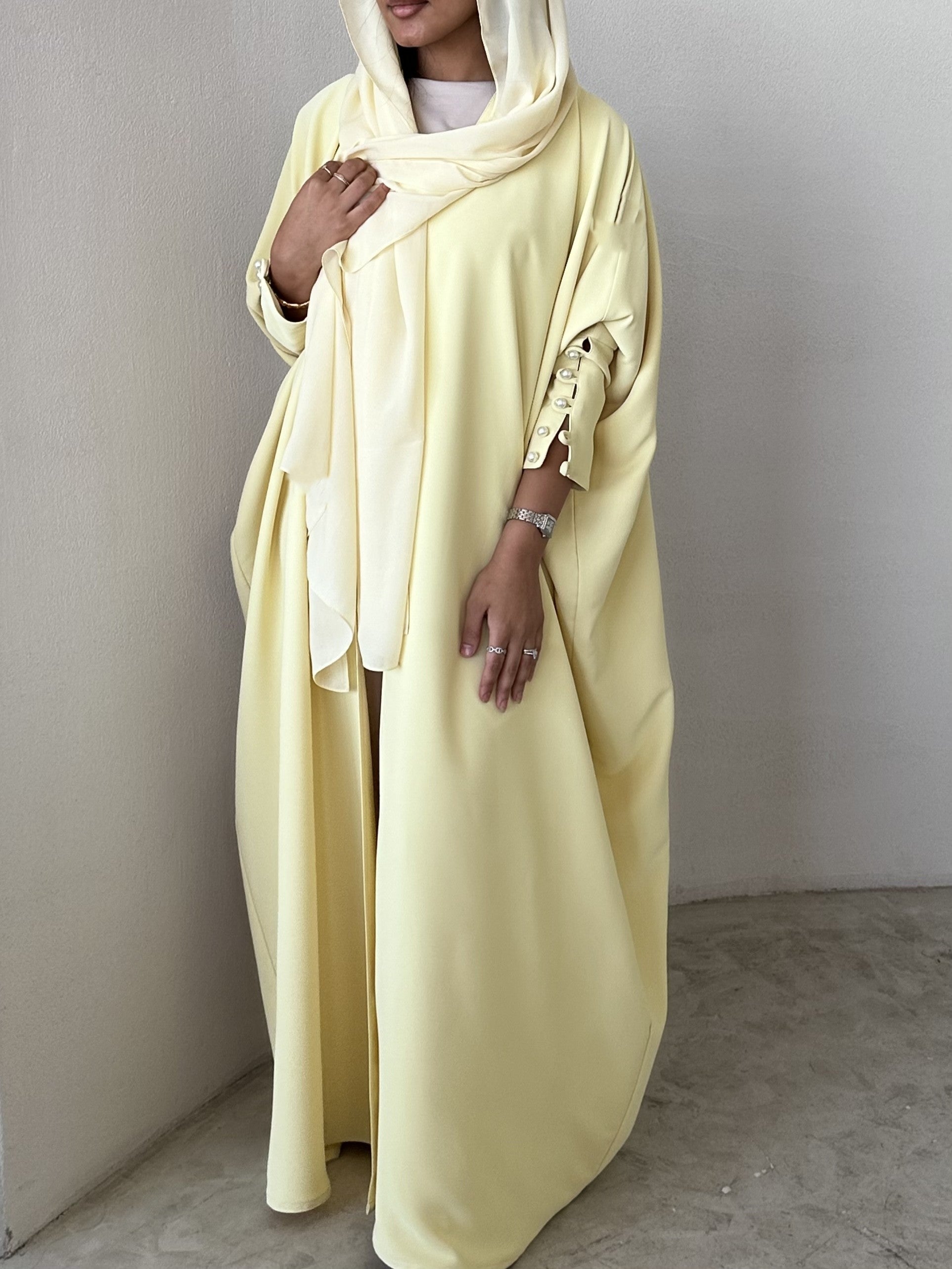 Yellow crepe abaya, bisht style with Pearl Buttons