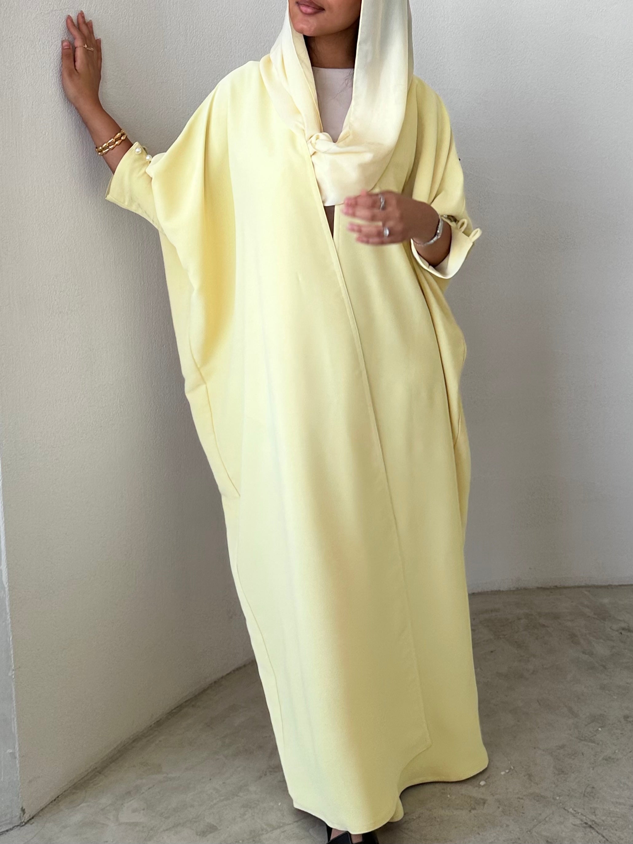 Yellow crepe abaya, bisht style with Pearl Buttons