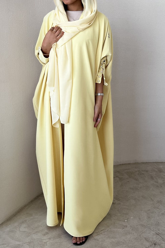 Yellow crepe abaya, bisht style with Pearl Buttons