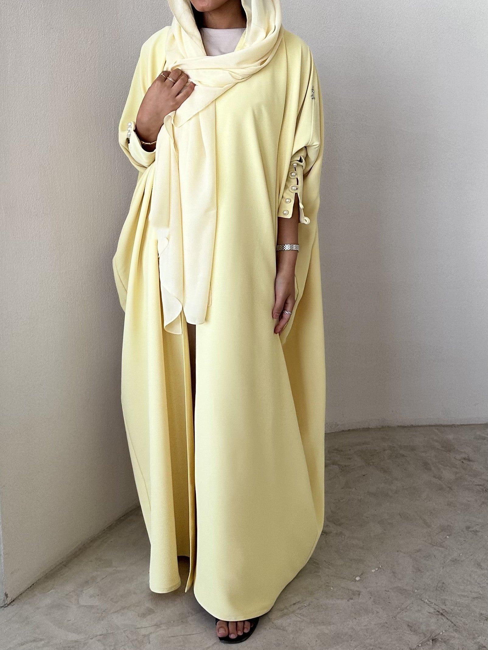 Yellow crepe abaya, bisht style with Pearl Buttons