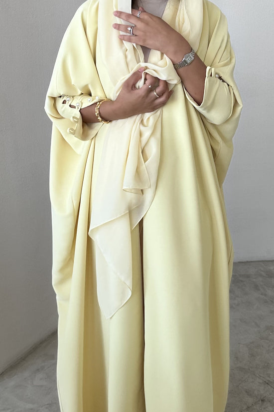 Yellow crepe abaya, bisht style with Pearl Buttons