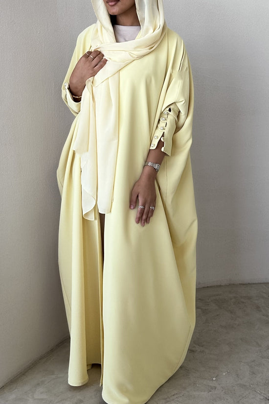 Yellow crepe abaya, bisht style with Pearl Buttons