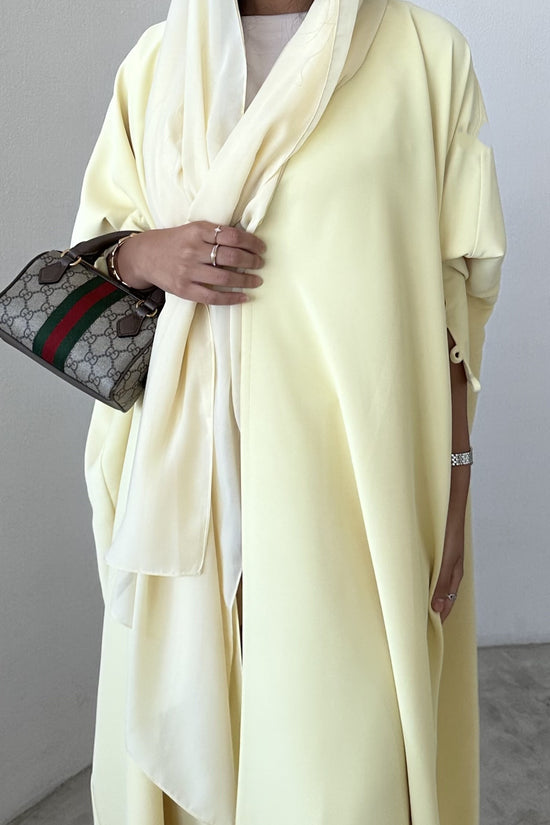 Yellow crepe abaya, bisht style with Pearl Buttons
