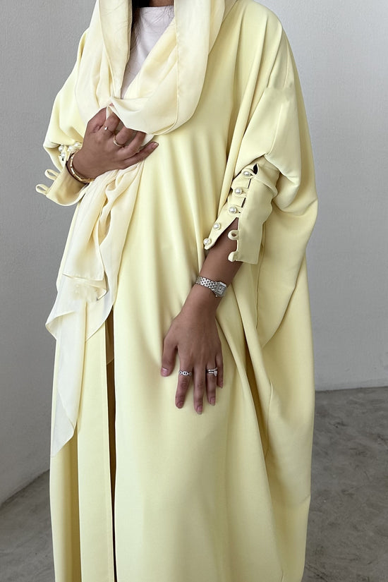 Yellow crepe abaya, bisht style with Pearl Buttons