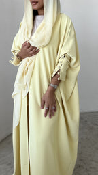 Yellow crepe abaya, bisht style with Pearl Buttons